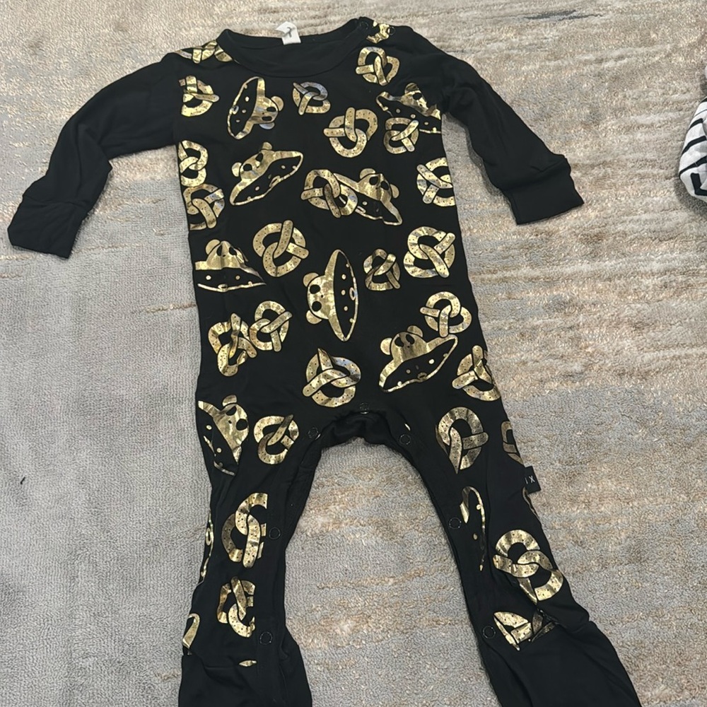 Huxbaby size 12-18 month one piece with gold pretzels